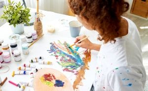 woman painting on desk