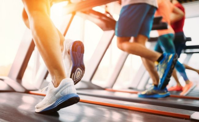 Folks running on treadmill - morning sunlight