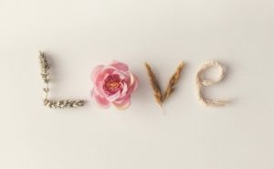 the word love spelled out with leaves flowers